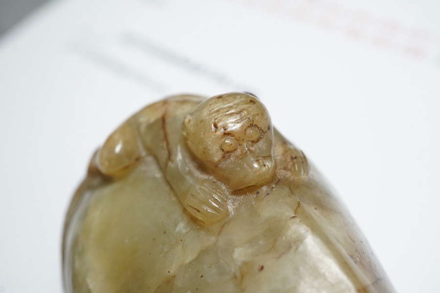 A Chinese celadon and mottled brown jade figure of a monkey climbing on a recumbent horse, Ming dynasty, 16th-17th century